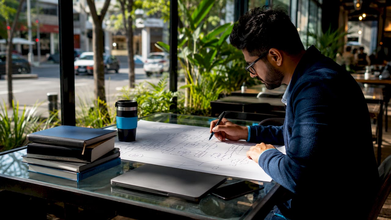 Engineer reviewing service mesh architecture diagram